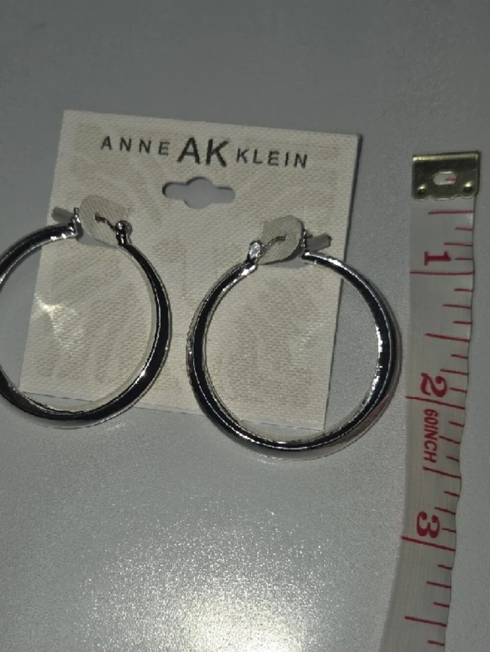 Anne Klein Shiny Silver Rounded Hoop Earrings